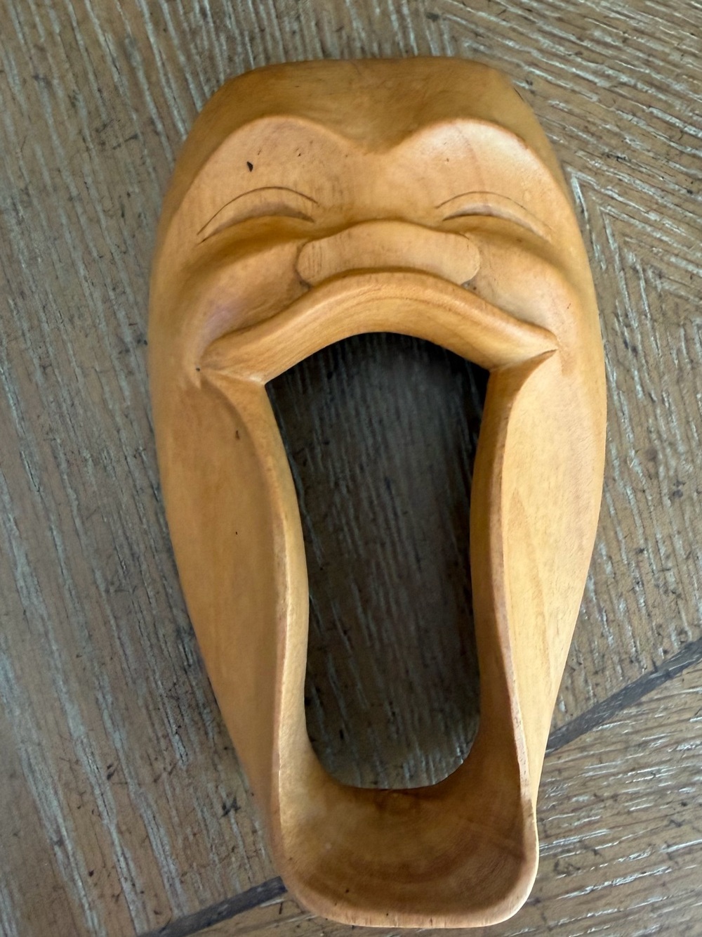 Hand-Carved laughing Mask Wall Accent in Natural Wood